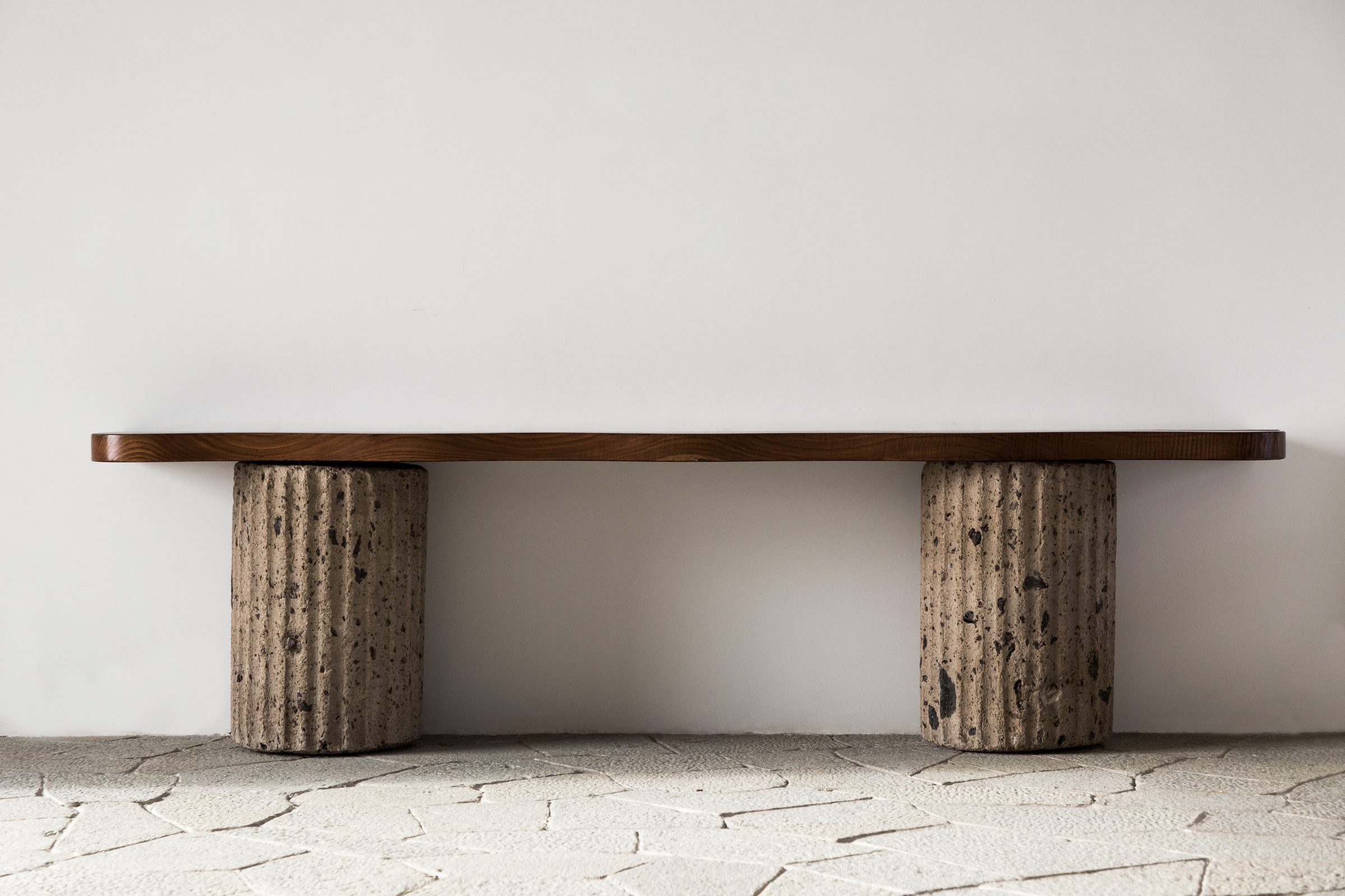 Walnut and tuff stone console